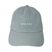 Load image into Gallery viewer, Light blue baseball cap with white embroidered text that says "DOG DAD" across the front.
